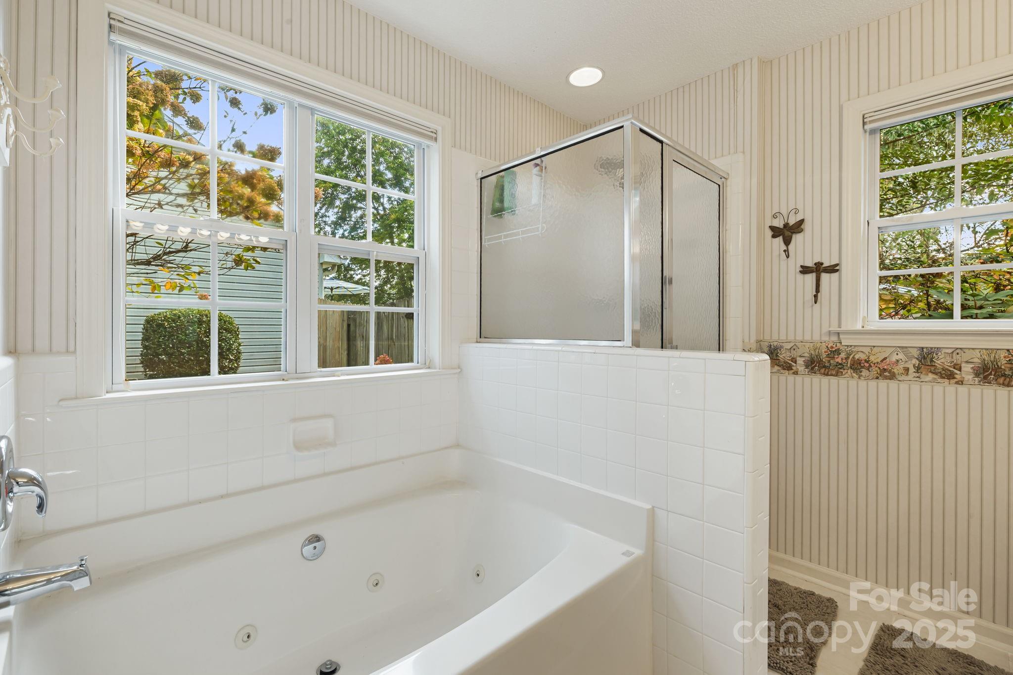 107 South Sunberry Trail Fletcher, NC 28732 - Photo 20 of 30 a bathroom with a bathtub and a shower