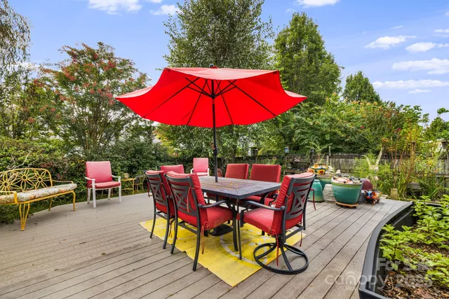 an outdoor space with furniture and umbrella
