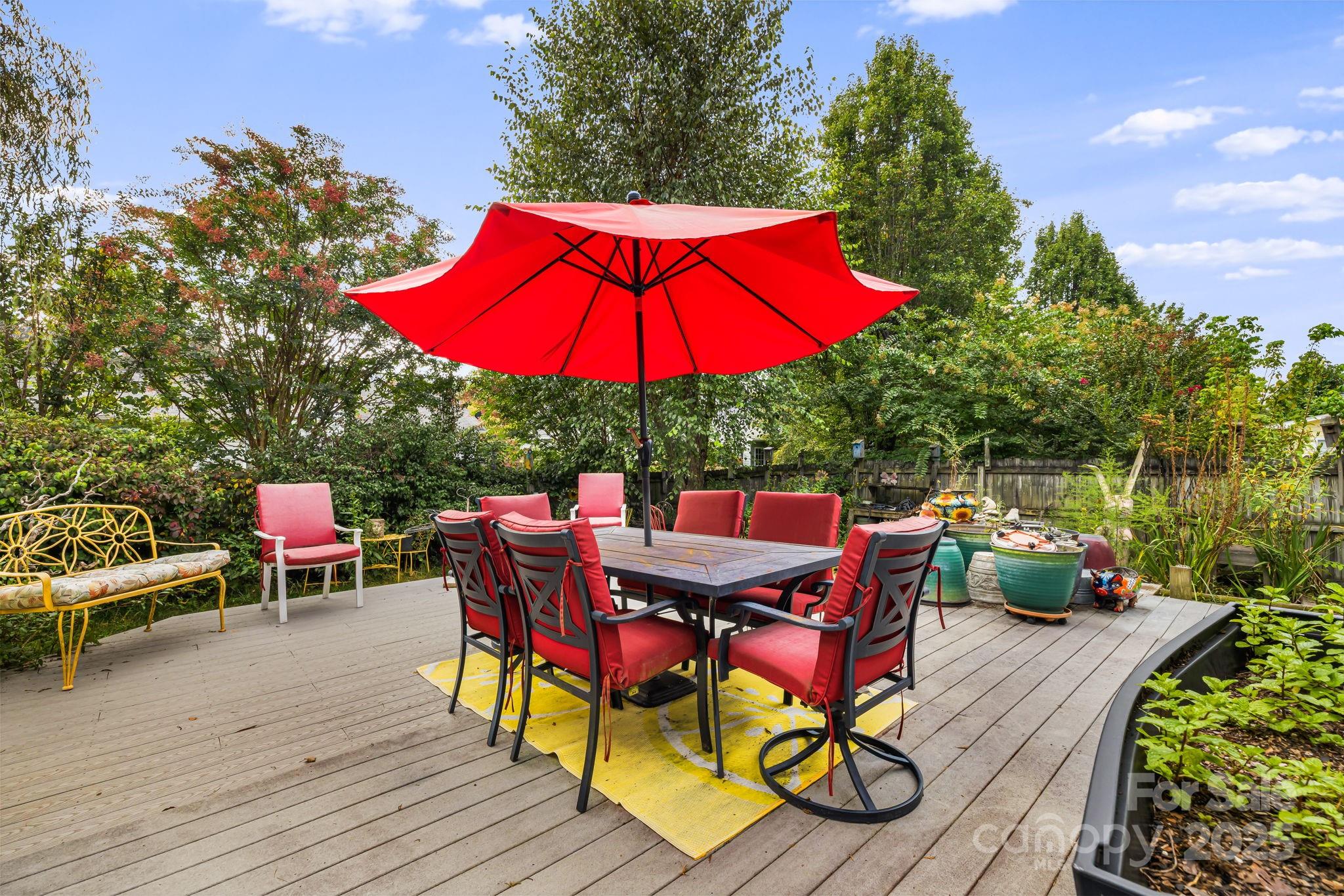 107 South Sunberry Trail Fletcher, NC 28732 - Photo 26 of 30 an outdoor space with furniture and umbrella