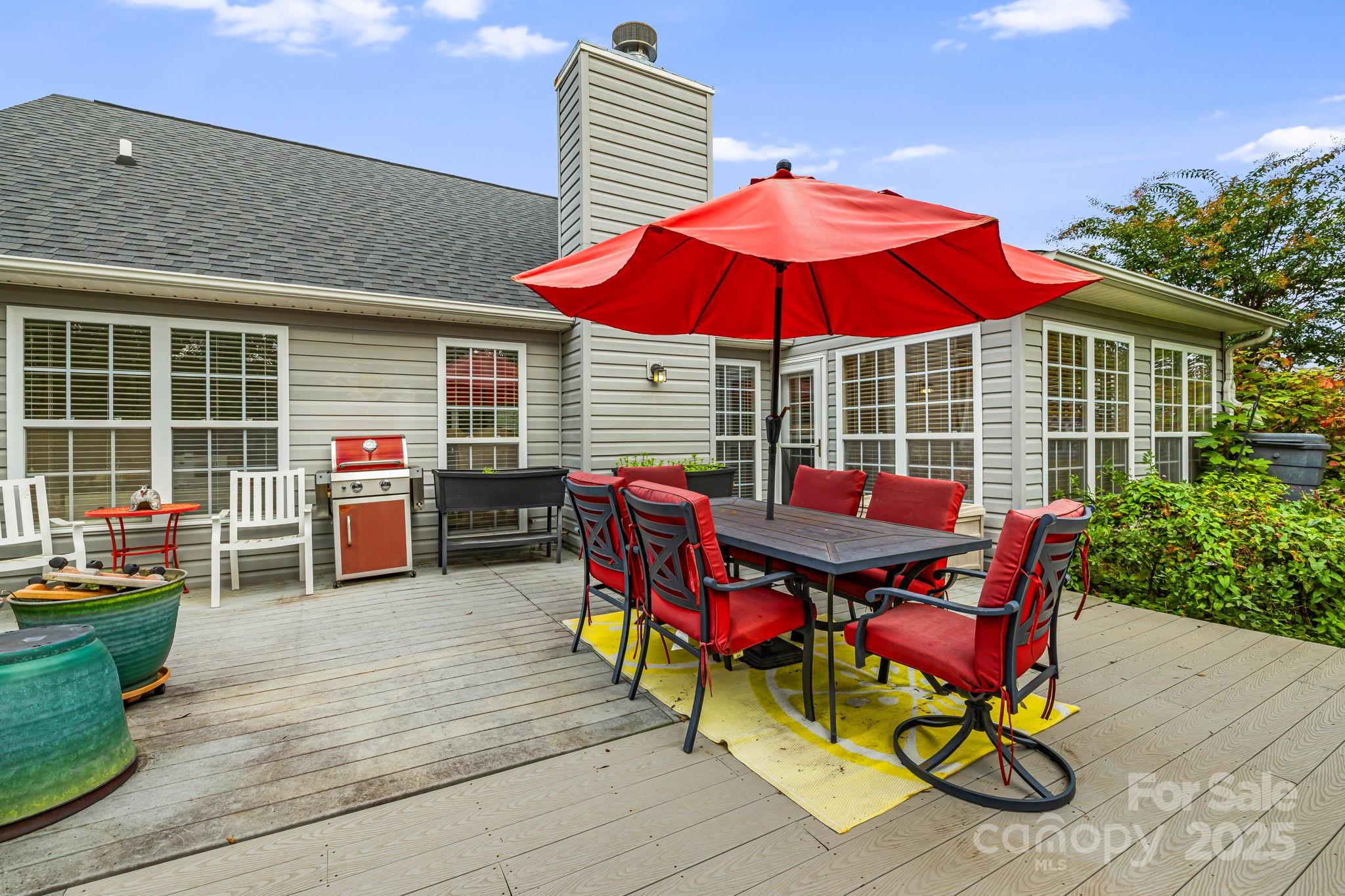 107 South Sunberry Trail Fletcher, NC 28732 - Photo 27 of 30 a view of a chairs and table in the patio with a small yard