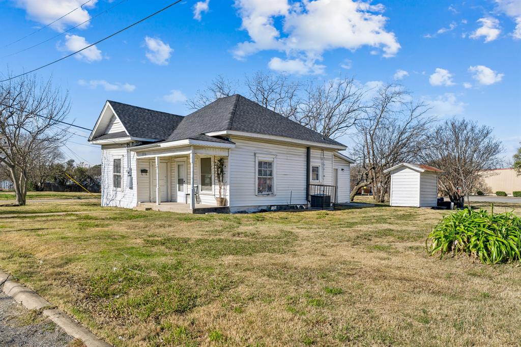 319 McKinney Street Mesquite, TX 75149 - Photo 3 of 27 a front view of a house with a garden