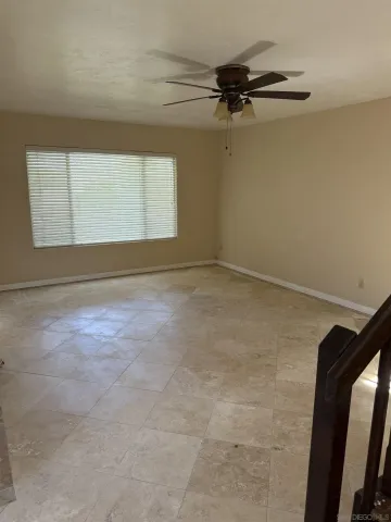 a view of a room with rack and a window