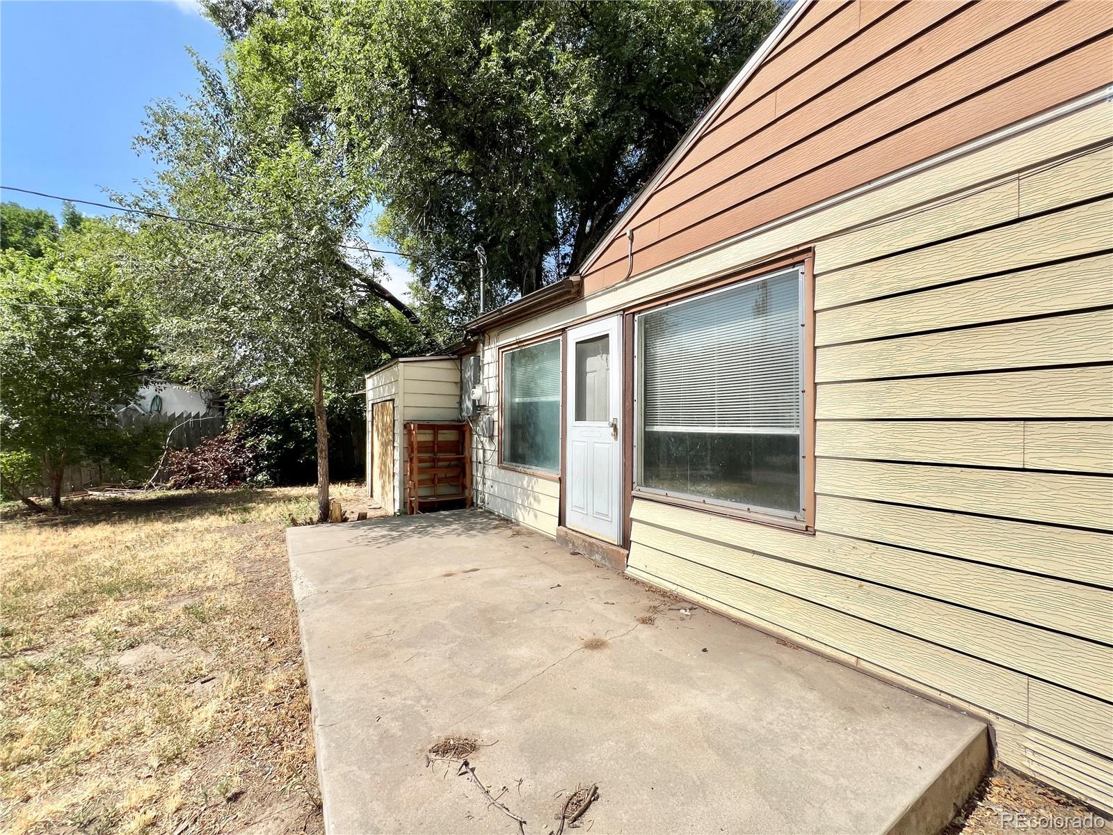 3580 Oneida Street Denver, CO 80207 - Photo 12 of 13 a view of a house with a patio