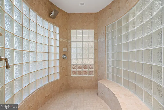 a bathroom with a bathtub and shower