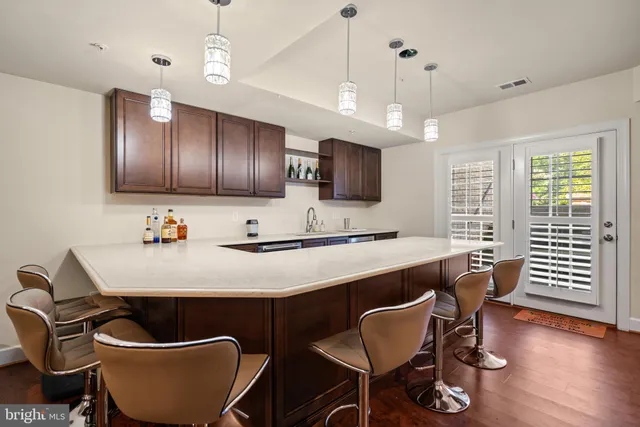 a large kitchen with a table and chairs