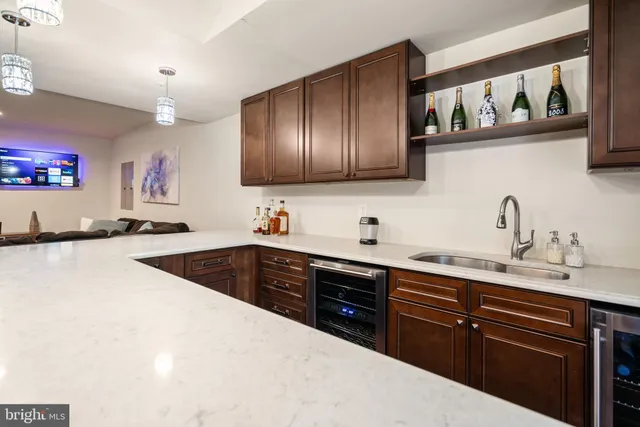 a kitchen with a sink a stove and cabinets