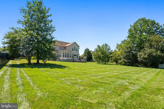 a view of a swimming pool with an outdoor space and seating area
