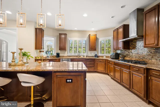a kitchen with stainless steel appliances granite countertop a sink and cabinets