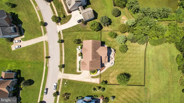 an aerial view of residential house with outdoor space and swimming pool