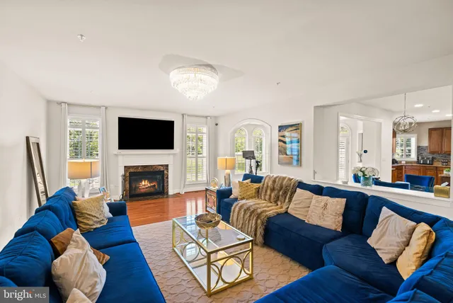 a living room with furniture fireplace and a flat screen tv