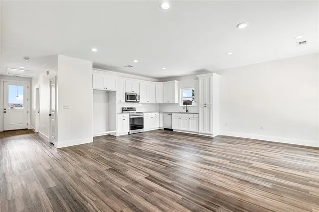 a view of kitchen with wooden floor