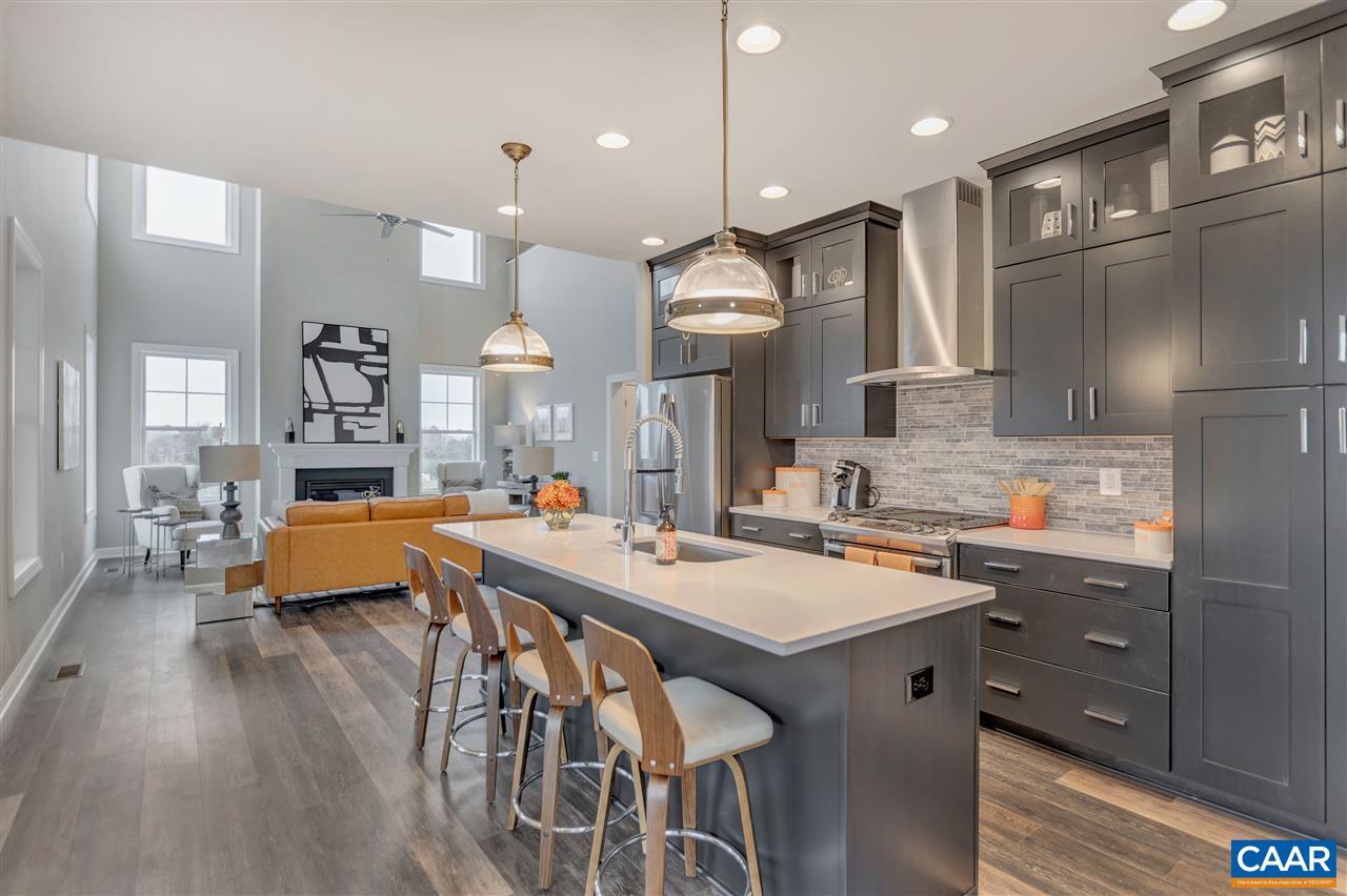 3490 Thicket Run Place Charlottesville, VA 22911 - Photo 11 of 36 a kitchen with a table chairs refrigerator and wooden floor
