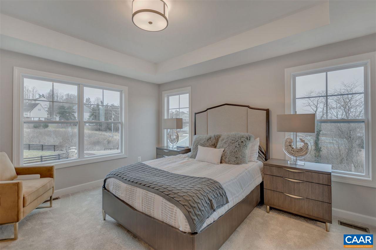 3490 Thicket Run Place Charlottesville, VA 22911 - Photo 13 of 36 a bedroom with a large bed and a window