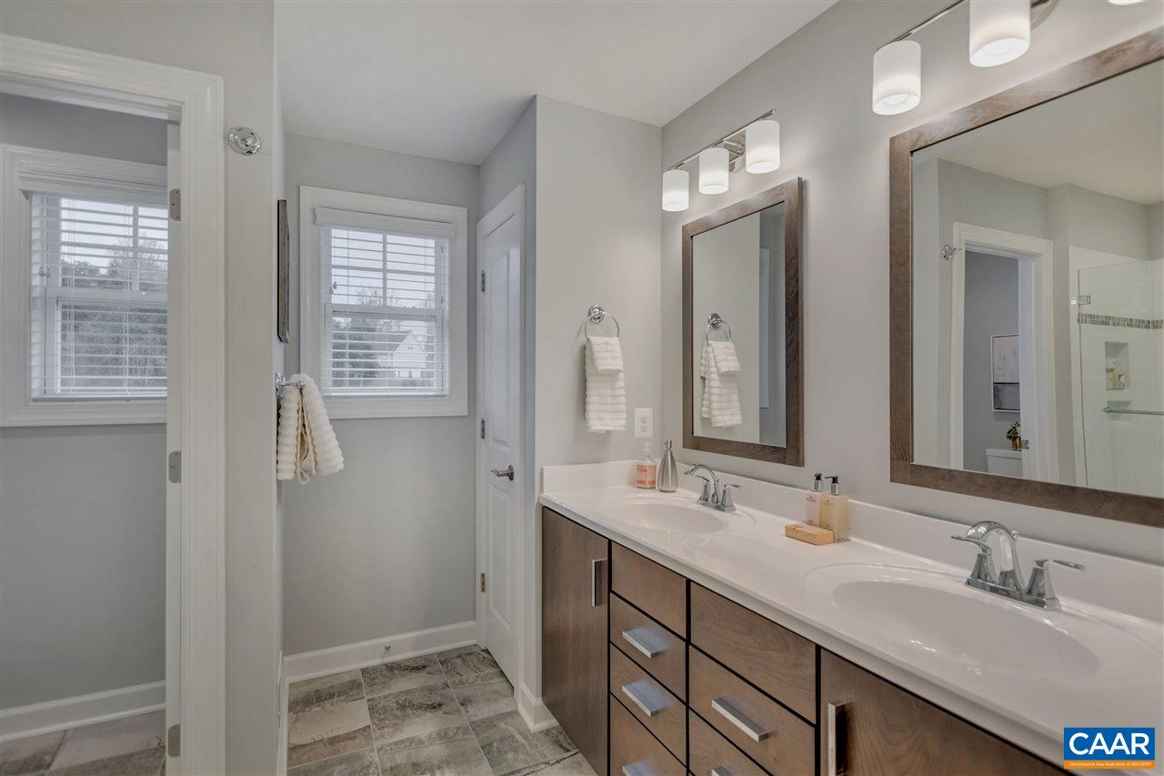 3490 Thicket Run Place Charlottesville, VA 22911 - Photo 14 of 36 a bathroom with double vanity sinks and a mirror