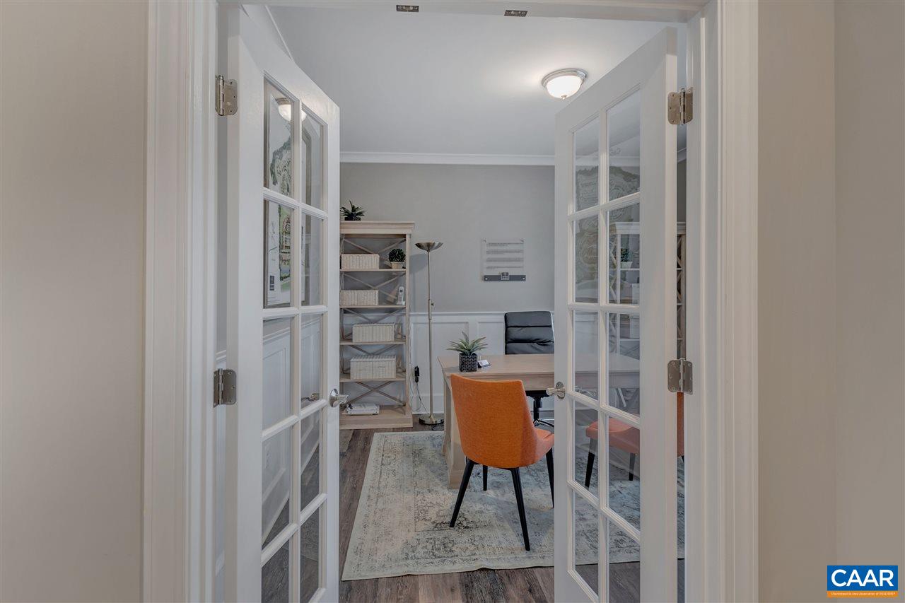 3490 Thicket Run Place Charlottesville, VA 22911 - Photo 3 of 36 a room with furniture a rug and a wall painting