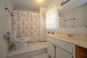 a bathroom with a sink a toilet and a bathtub