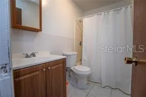a bathroom with a sink toilet and vanity