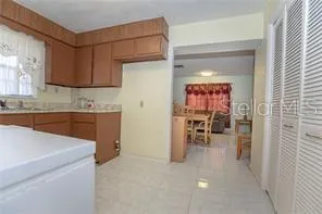 a kitchen with a sink cabinets and window