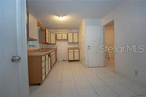 a view of a kitchen with cabinets