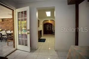 a view of entryway and hall with dining area