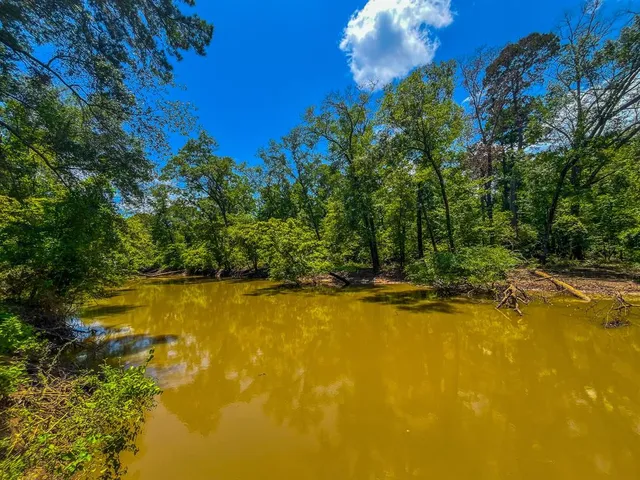 a view of a swimming pool with an outdoor space and seating area