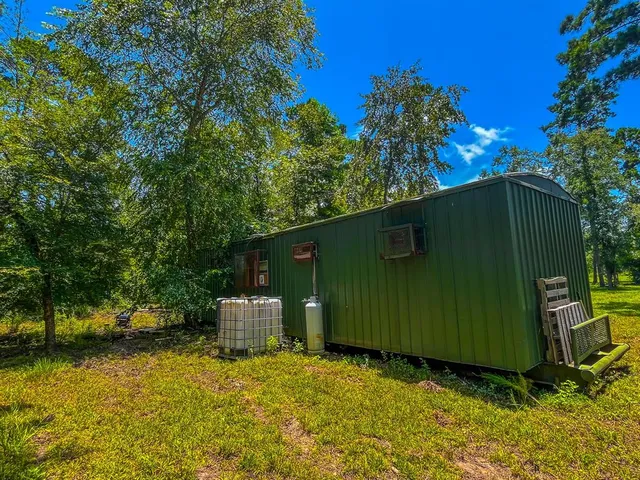 a view of a back yard of the house