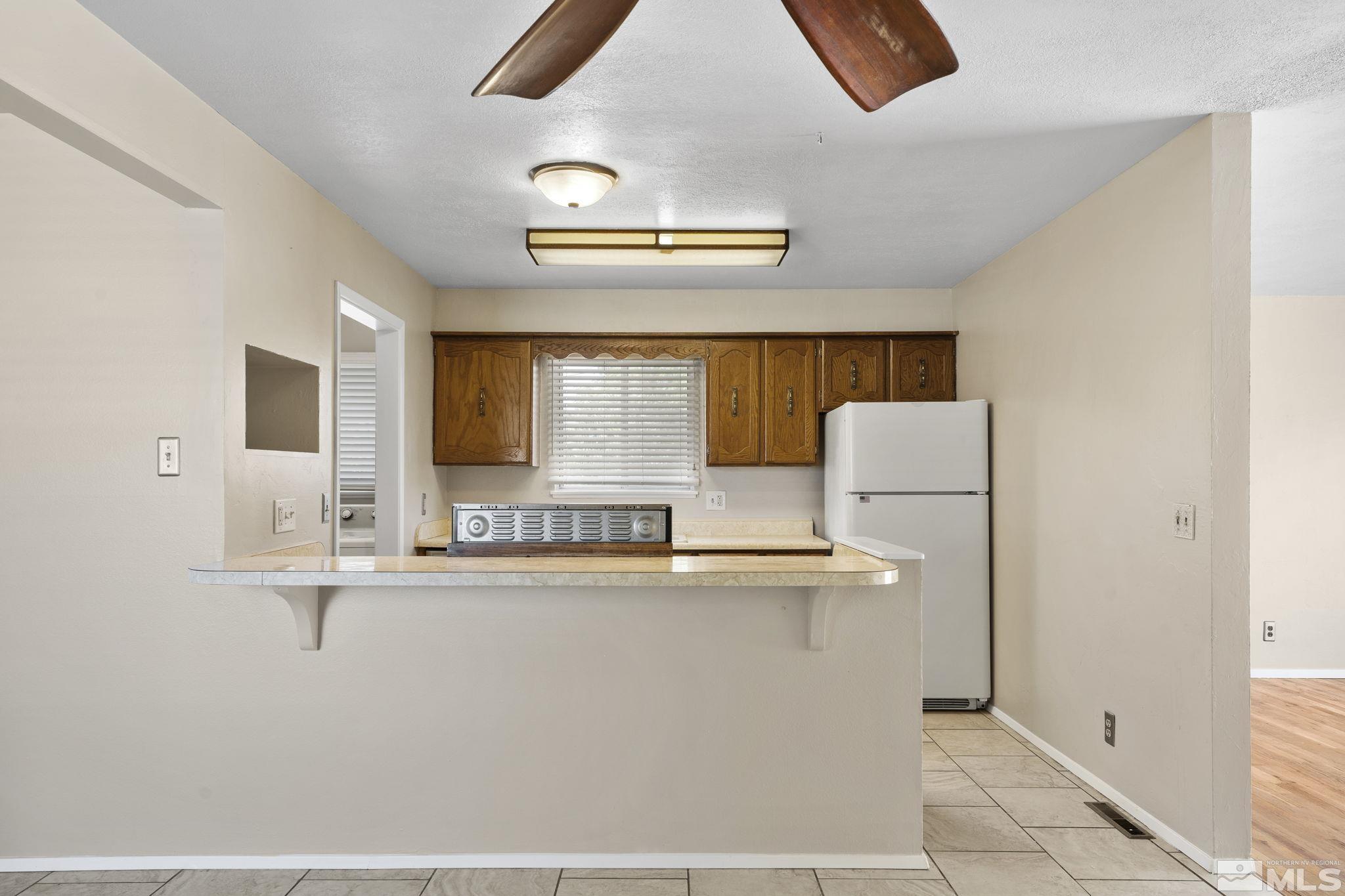 3475 Greta Place Reno, NV 89503 - Photo 11 of 36 a kitchen with stainless steel appliances a sink and a stove