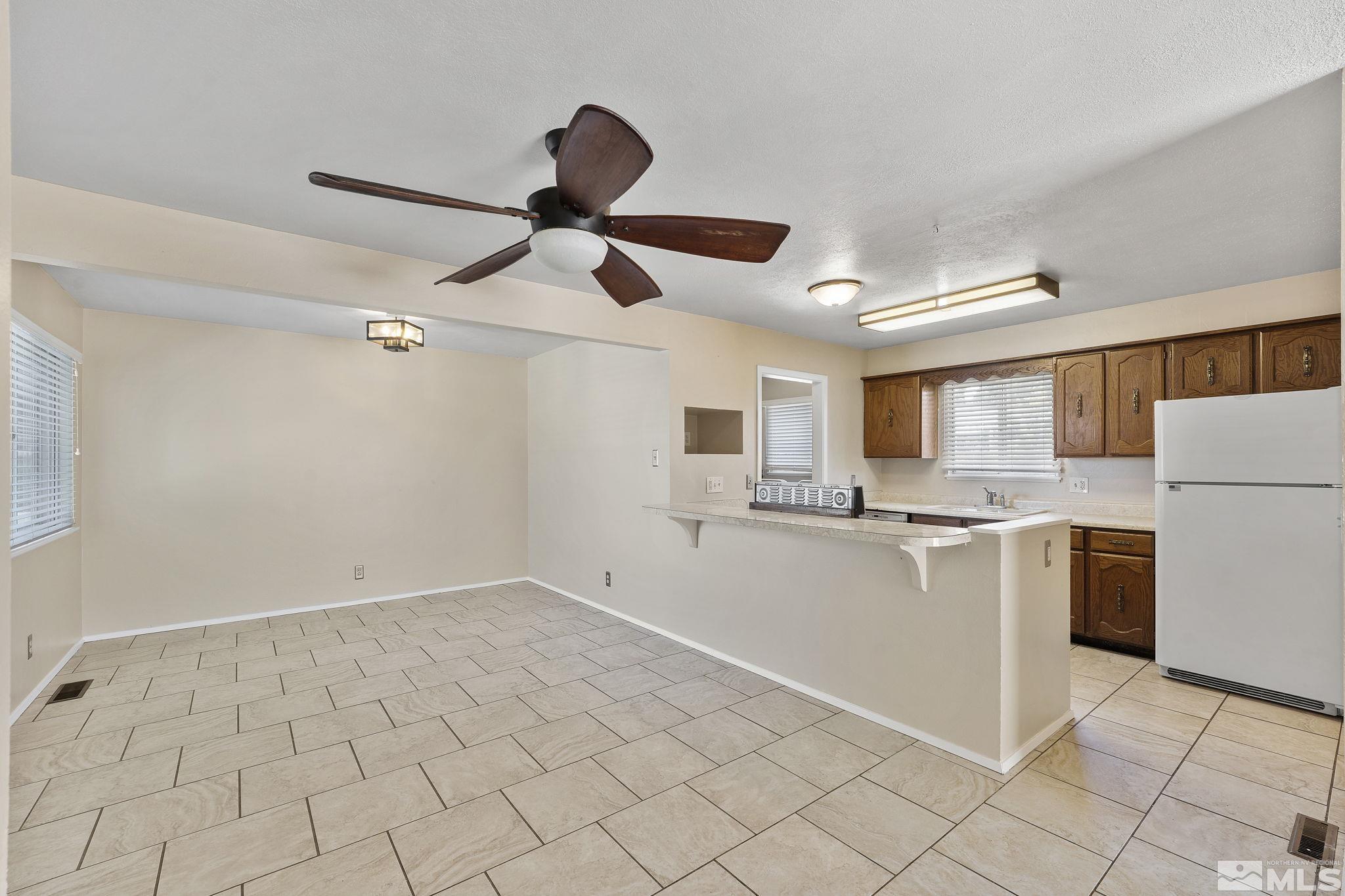 3475 Greta Place Reno, NV 89503 - Photo 12 of 36 a kitchen with cabinets and stainless steel appliances