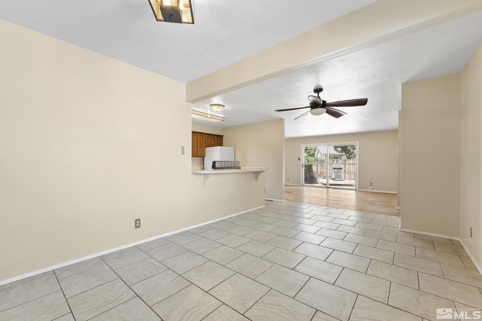 3475 Greta Place Reno, NV 89503 - Photo 15 of 36 a view of a livingroom with wooden floor and a ceiling fan