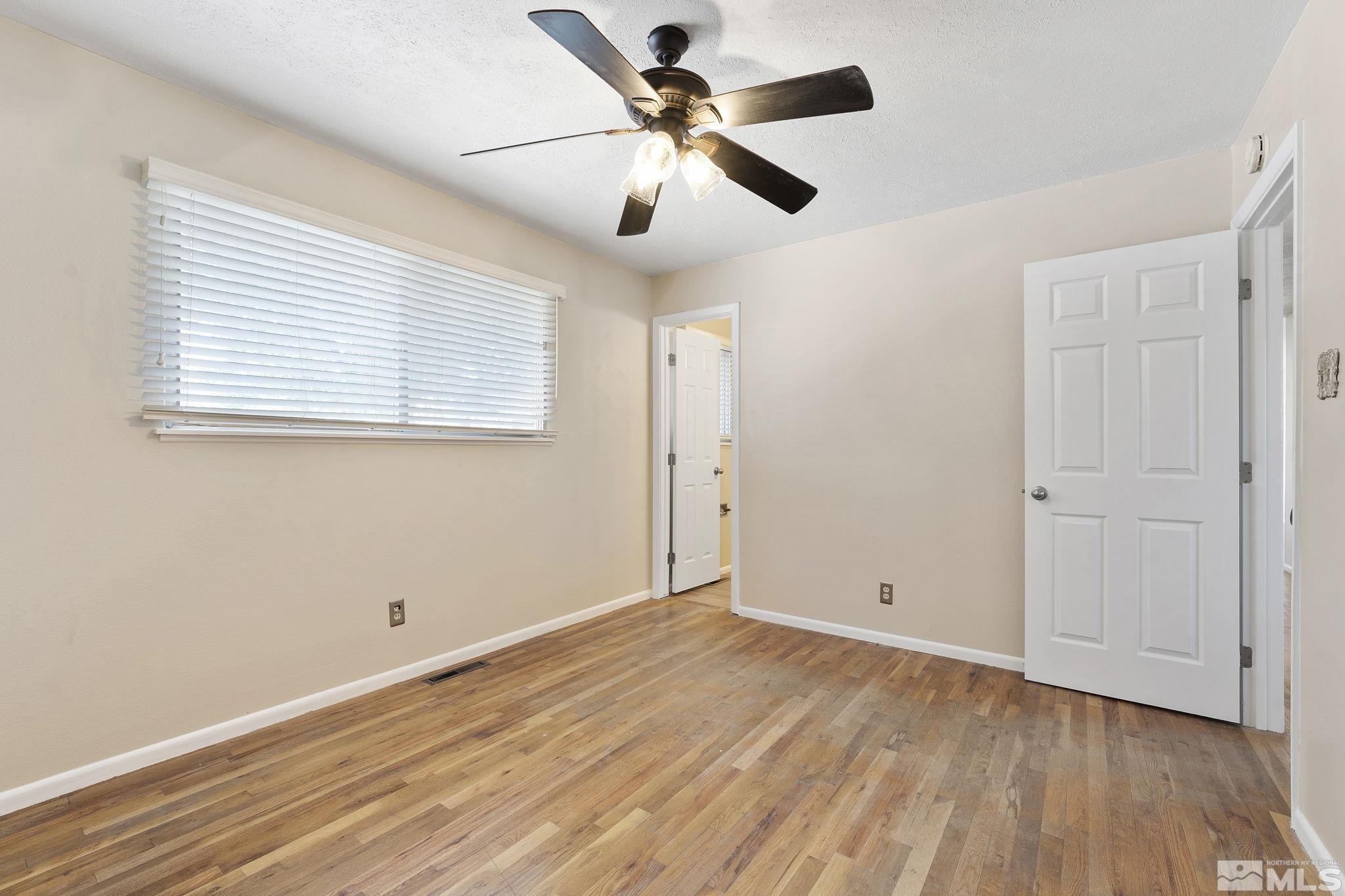 3475 Greta Place Reno, NV 89503 - Photo 17 of 36 a view of empty room with wooden floor