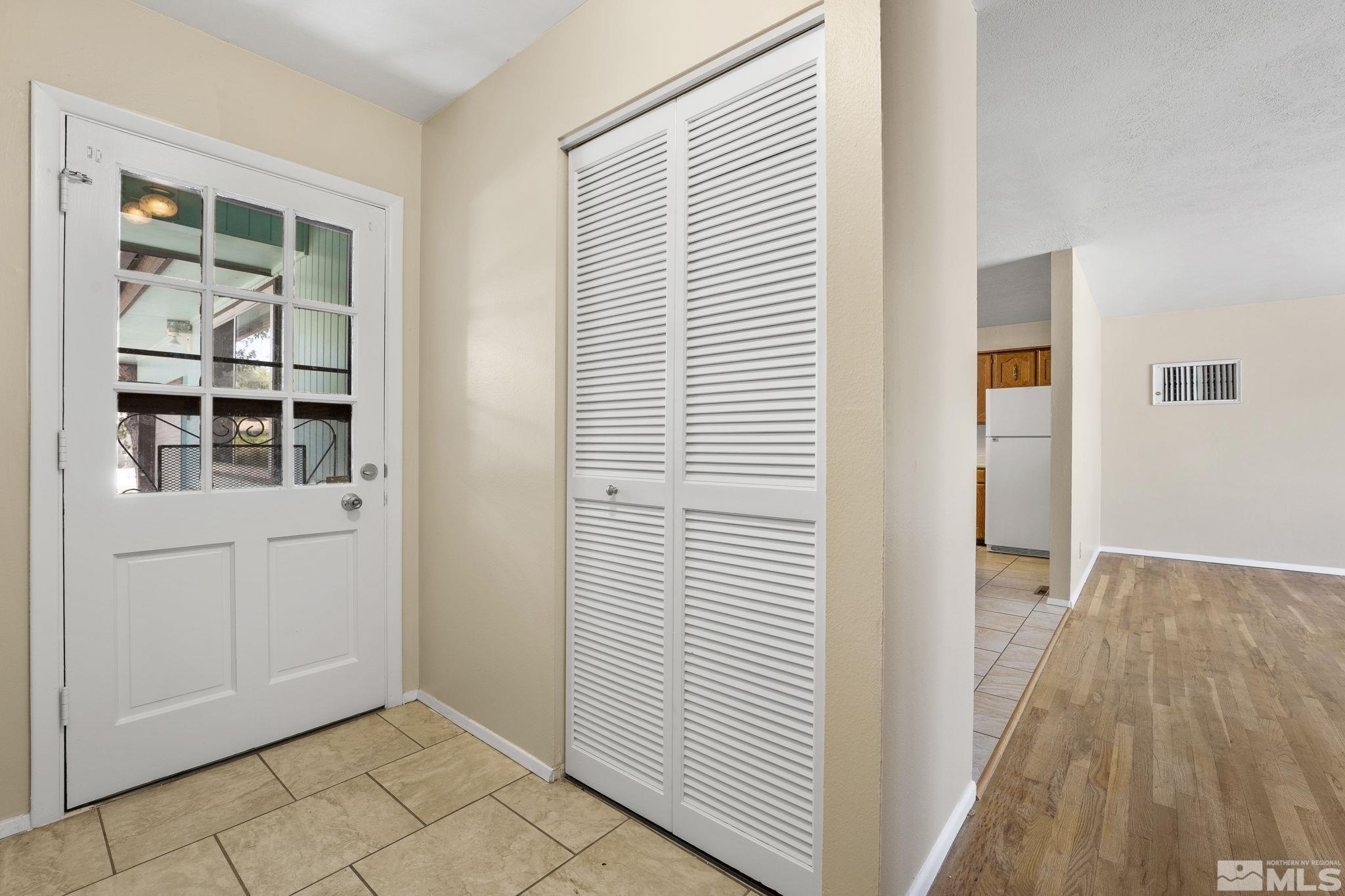 3475 Greta Place Reno, NV 89503 - Photo 2 of 36 a view of empty room with wooden floor and entryway