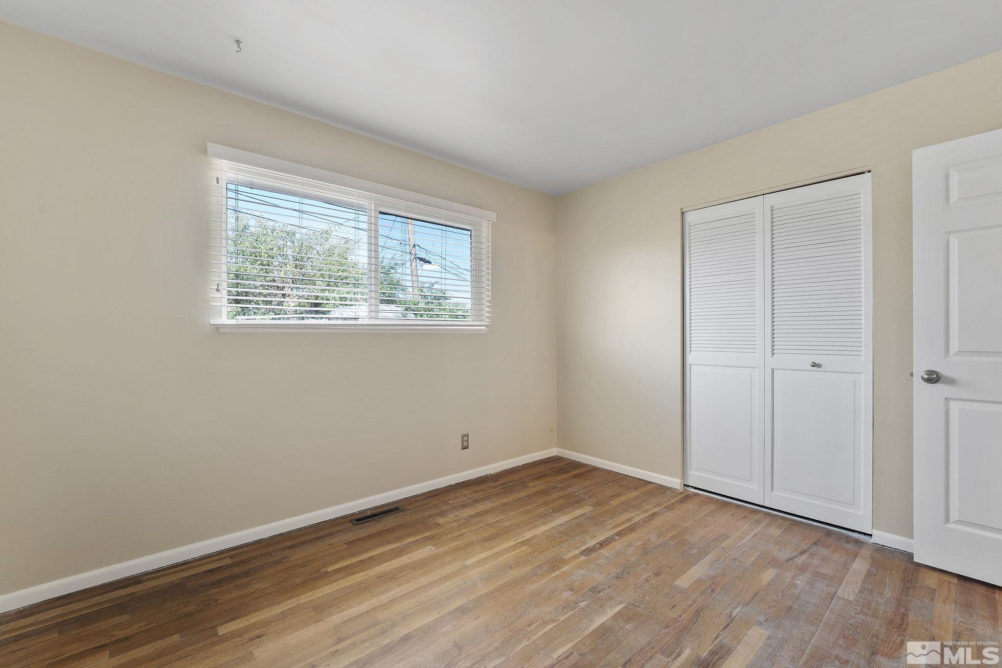 3475 Greta Place Reno, NV 89503 - Photo 23 of 36 a view of an empty room with wooden floor and a window
