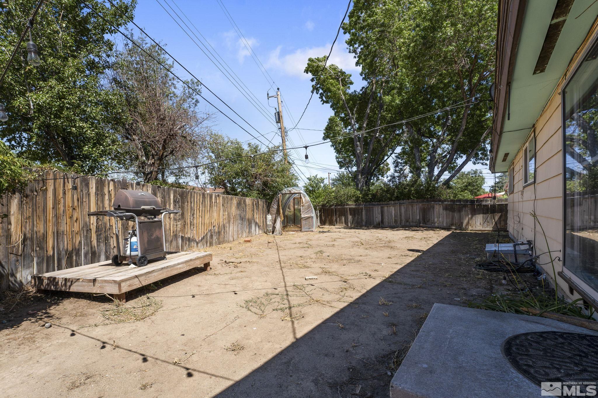 3475 Greta Place Reno, NV 89503 - Photo 30 of 36 a view of a backyard with wooden fence