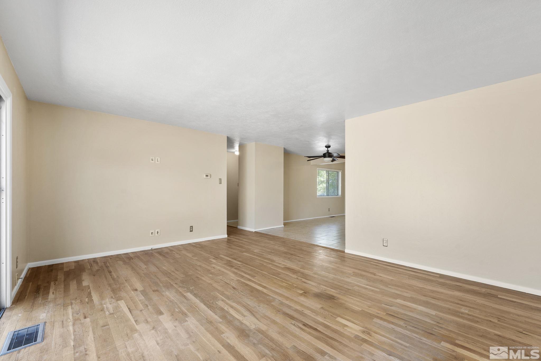 3475 Greta Place Reno, NV 89503 - Photo 5 of 36 a view of an empty room with wooden floor