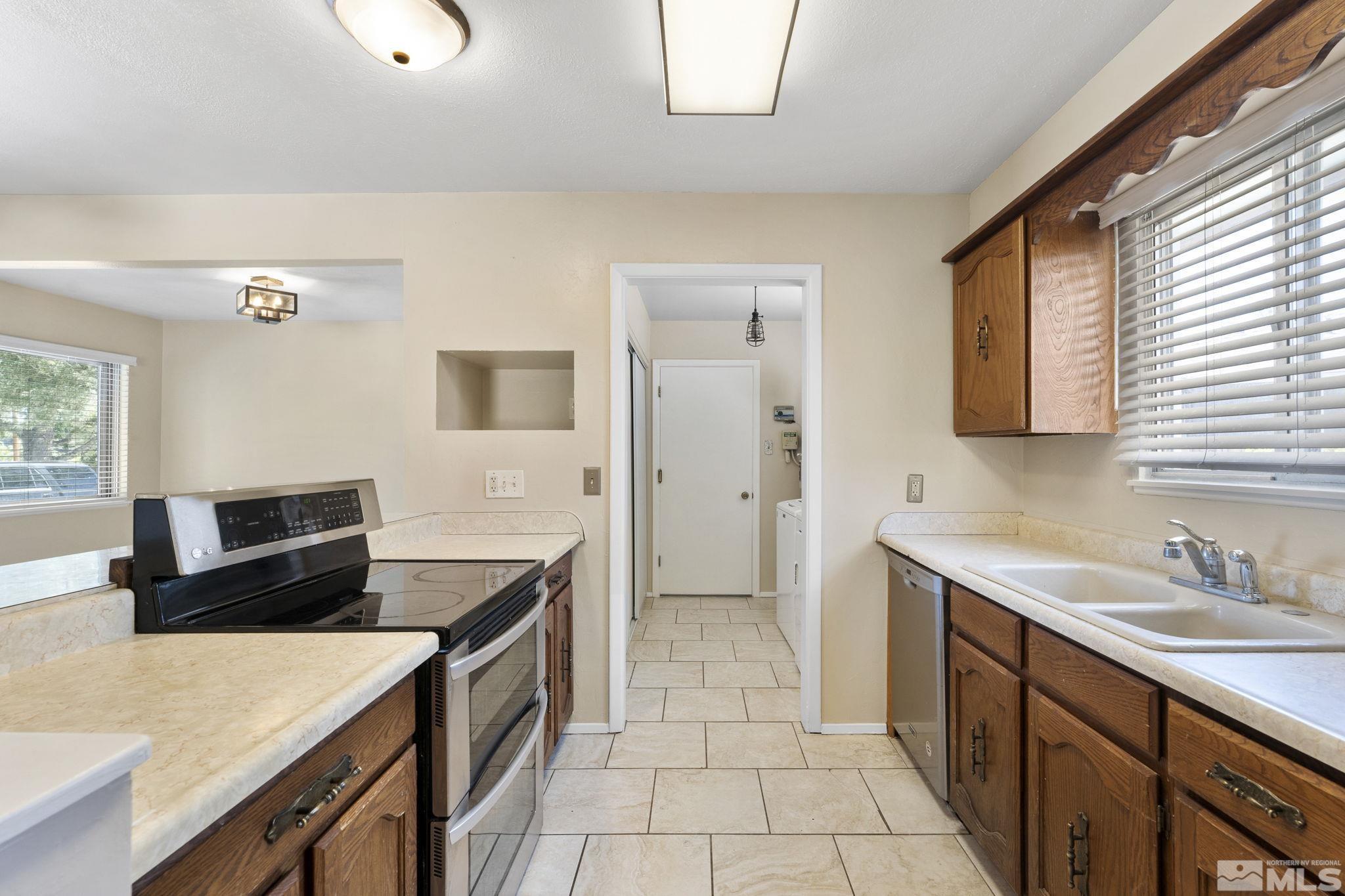3475 Greta Place Reno, NV 89503 - Photo 7 of 36 a kitchen with a stove and a sink
