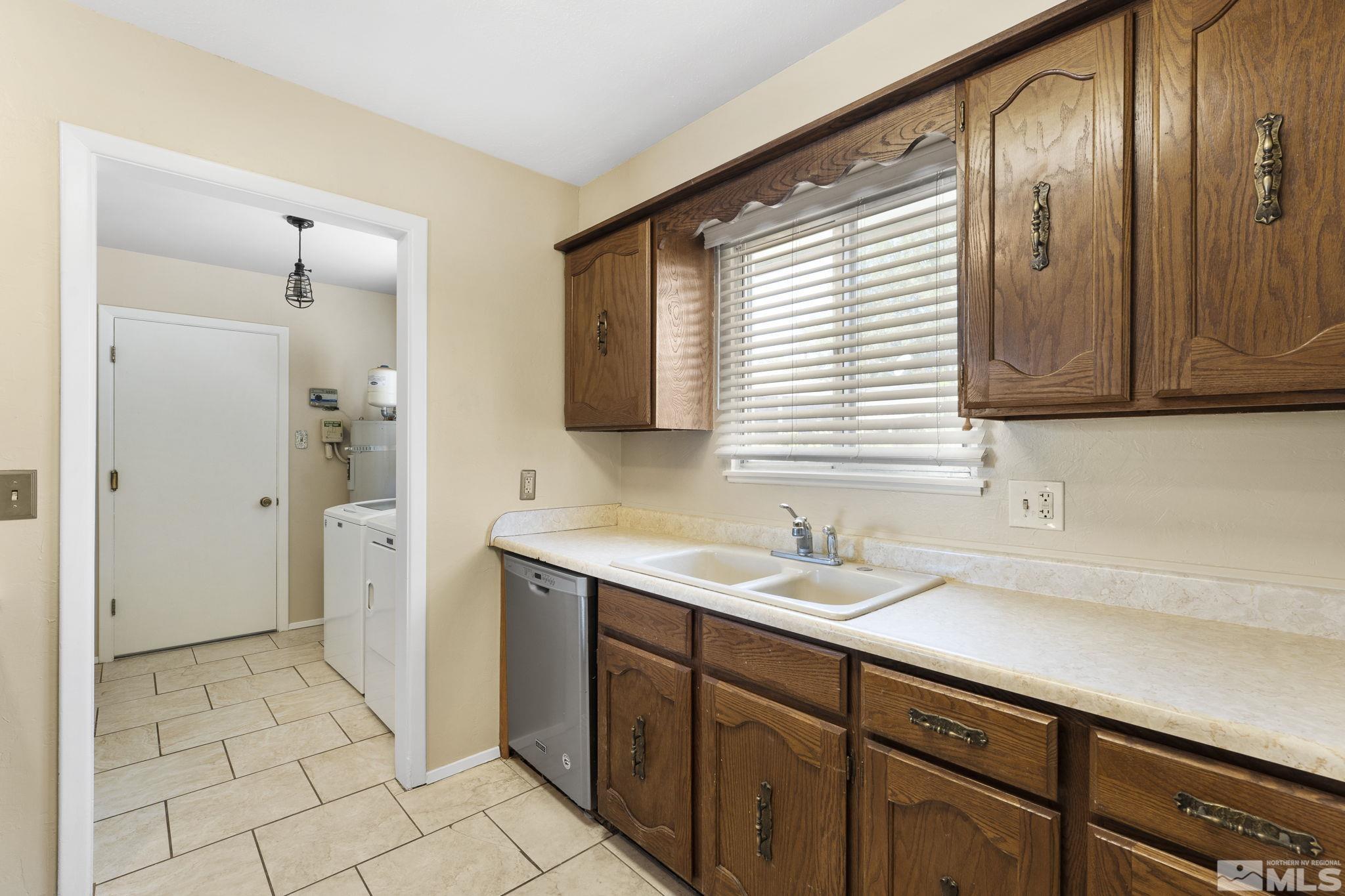 3475 Greta Place Reno, NV 89503 - Photo 8 of 36 a bathroom with a sink a mirror and a shower