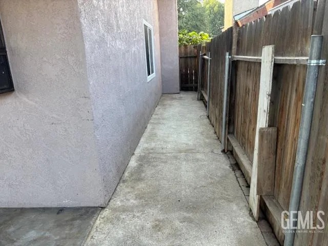 a view of a pathway with a wooden door