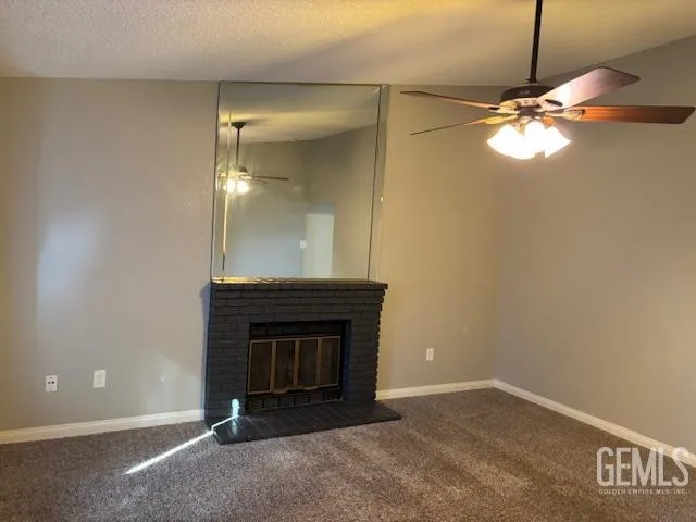 a room with a fireplace and a chandelier