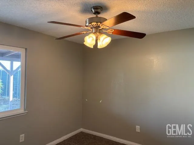 a view of a chandelier fan and a table