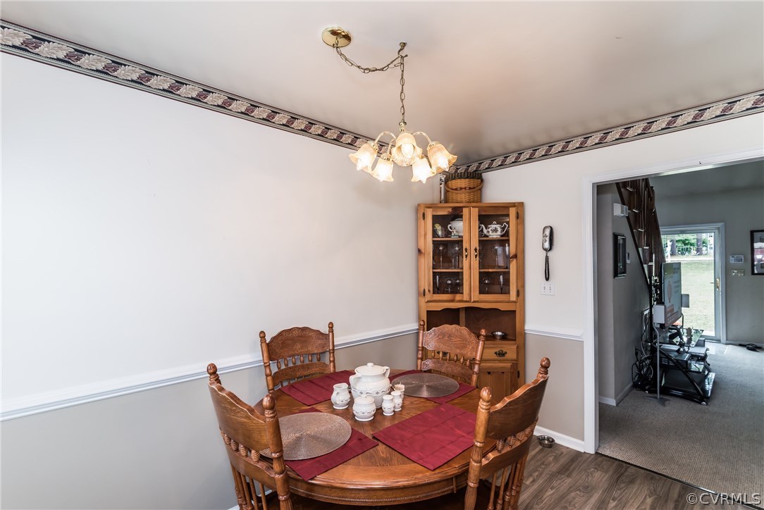17445 Loving Union Road Disputanta, VA 23842 - Photo 15 of 50 a dining room with furniture and chandelier