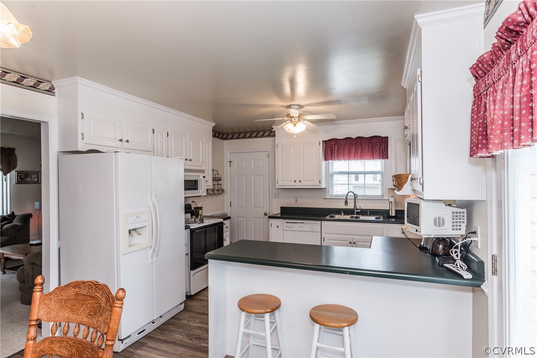 17445 Loving Union Road Disputanta, VA 23842 - Photo 16 of 50 a kitchen with stainless steel appliances granite countertop a sink stove and refrigerator