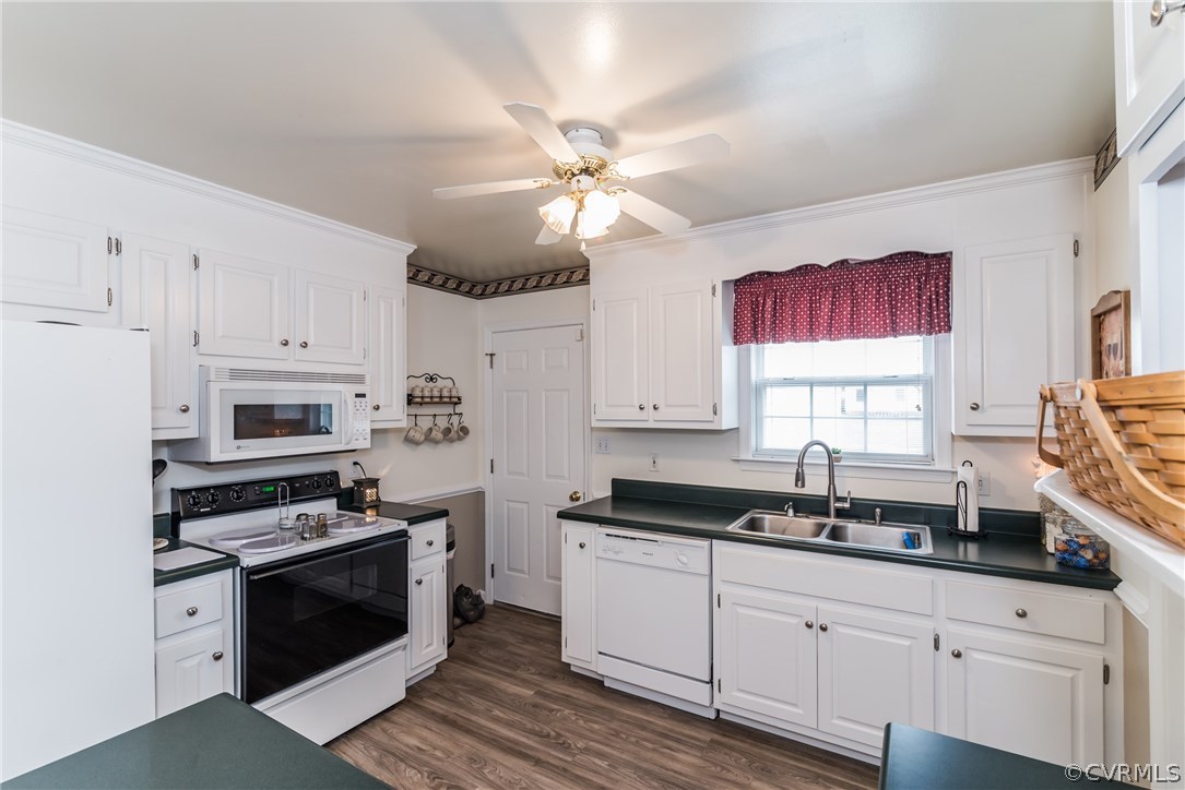 17445 Loving Union Road Disputanta, VA 23842 - Photo 19 of 50 a kitchen with granite countertop a sink cabinets stainless steel appliances and a window
