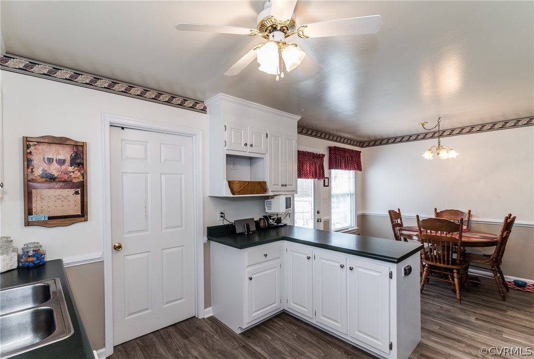 17445 Loving Union Road Disputanta, VA 23842 - Photo 20 of 50 a kitchen with stainless steel appliances granite countertop a sink dishwasher and a refrigerator with wooden floor