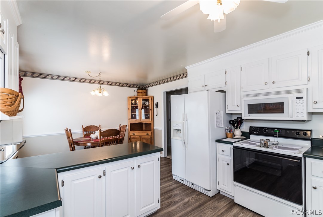 17445 Loving Union Road Disputanta, VA 23842 - Photo 21 of 50 a kitchen with stainless steel appliances a stove a sink and a refrigerator