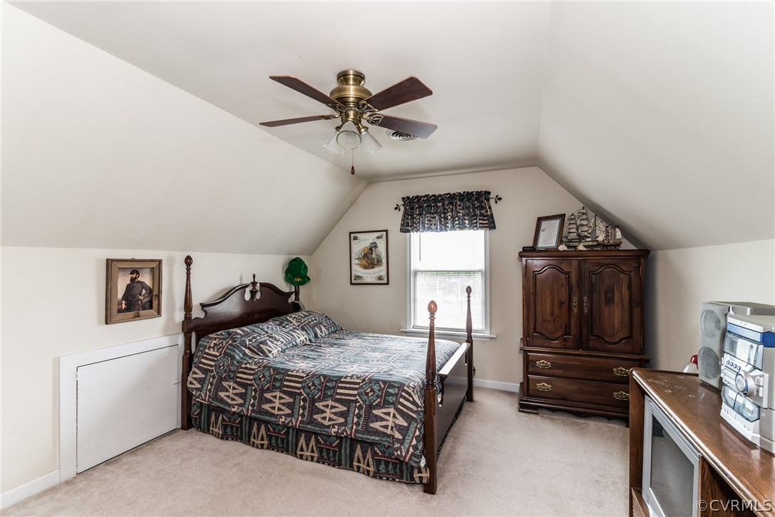 17445 Loving Union Road Disputanta, VA 23842 - Photo 23 of 50 a bedroom with a bed and a dresser