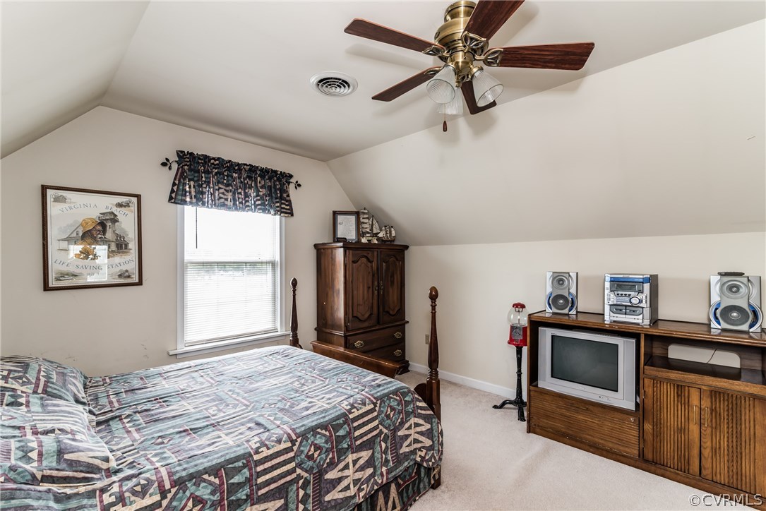 17445 Loving Union Road Disputanta, VA 23842 - Photo 24 of 50 a bedroom with a bed dresser and a window