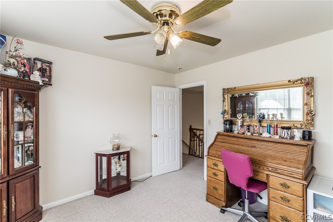 17445 Loving Union Road Disputanta, VA 23842 - Photo 31 of 50 a room with furniture a chandelier fan and a window