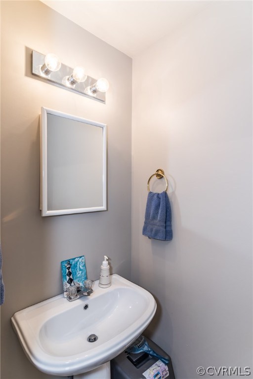 17445 Loving Union Road Disputanta, VA 23842 - Photo 6 of 50 a bathroom with a sink a mirror and vanity