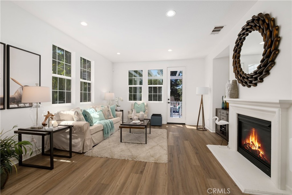 27 Reese Creek Ladera Ranch, CA 92694 - Photo 11 of 40 a living room with furniture a window and a fireplace