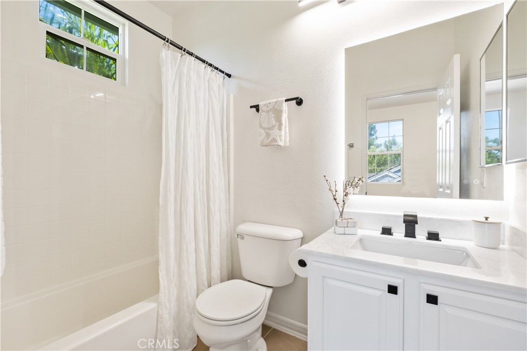 27 Reese Creek Ladera Ranch, CA 92694 - Photo 30 of 40 a bathroom with a sink a toilet and shower